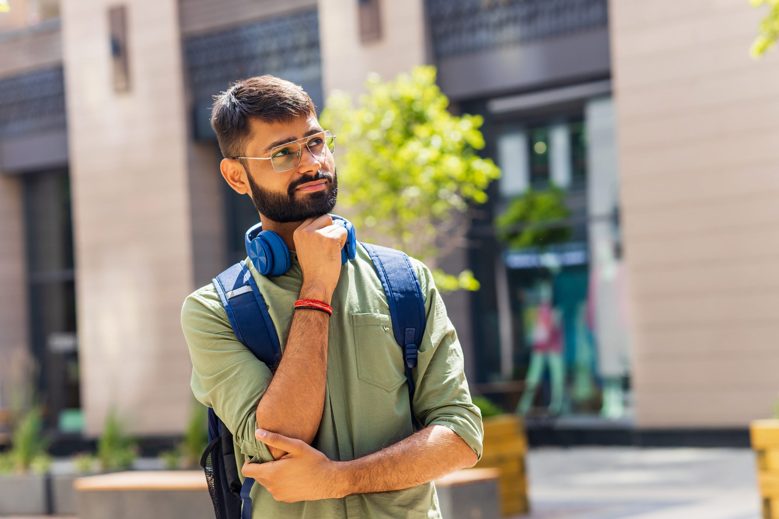 indian-student-with-blue-headset-and-backpack-look-2024-10-31-02-29-03-utc